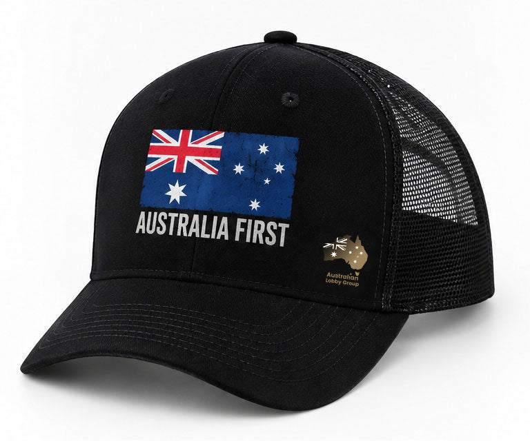 The Australian Lobby Group black trucker cap, angled view, with the AUSTRALIA FIRST Australian flag graphic on the front panel and a gold Australian map logo on the side panel.